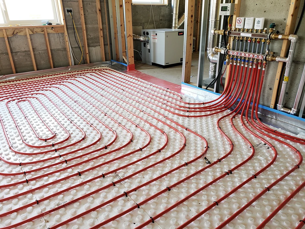 Plancher chauffant alimenté par une pompe à chaleur géothermique sur nappe